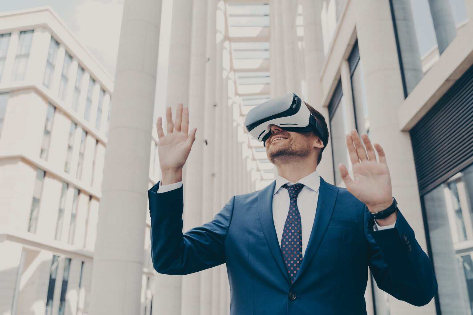 young-modern-businessman-in-vr-goggles-on-head