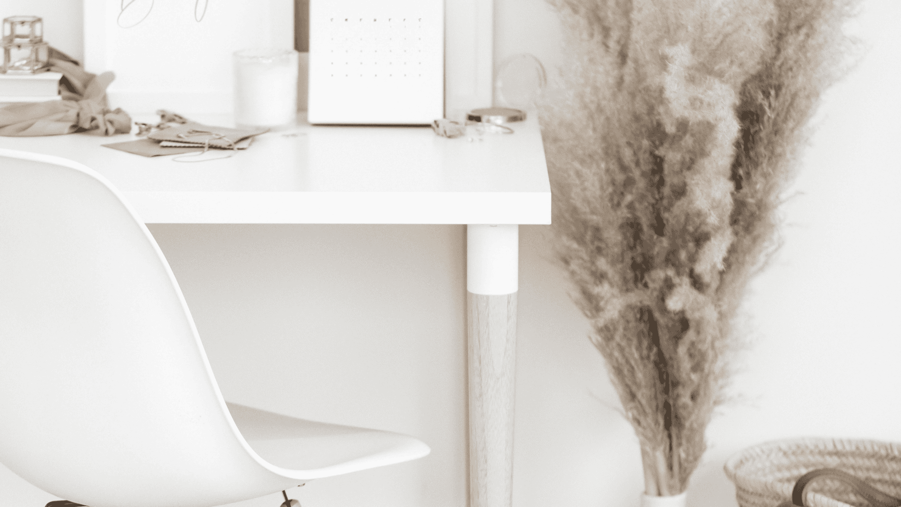 Cozy home office with desk, chair, and decorative plants for a productive workspace.